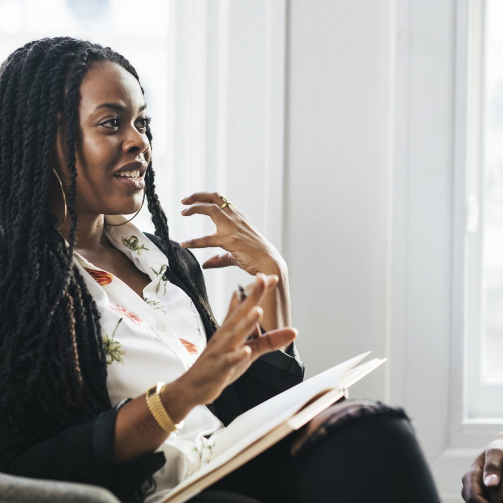 Black female boss talking at a meeting